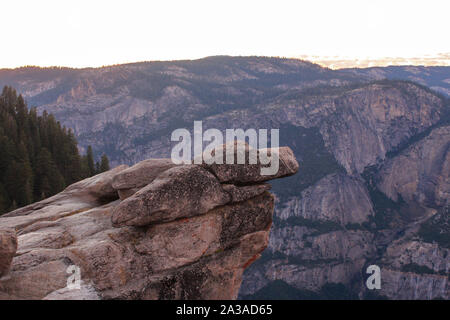 Overhanging rock with the view of famous Half Dome at Glacier Point, Yosemite National Park, California, USA Stock Photo