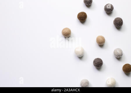 Knitted balls on white background. Winter decoration Stock Photo