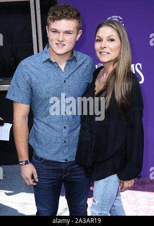 CENTURY CITY, LOS ANGELES, CALIFORNIA, USA - OCTOBER 06: David Vincent Turco and Paige Turco arrive at the World Premiere Of MGM's 'The Addams Family' held at the Westfield Century City AMC on October 6, 2019 in Century City, Los Angeles, California, United States. (Photo by Xavier Collin/Image Press Agency) Stock Photo