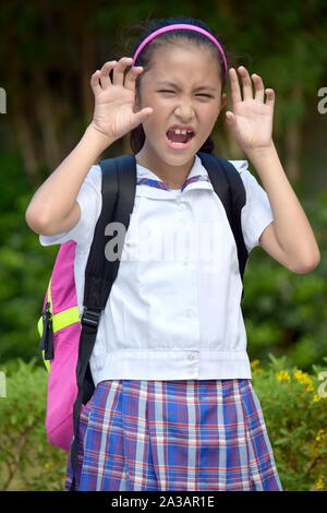 An Intimidating School Girl Wearing Uniform Stock Photo