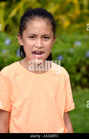 Youthful Filipina Teenage Female And Anger Stock Photo