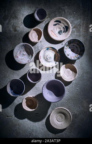 Different handmade ceramic on background. Stock Photo