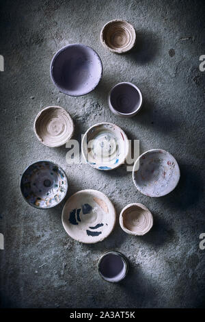 Different handmade ceramic on background. Stock Photo