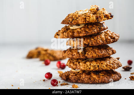 Healthy oatmeal cookies with cranberries and nuts. Healthy vegan food concept. Stock Photo
