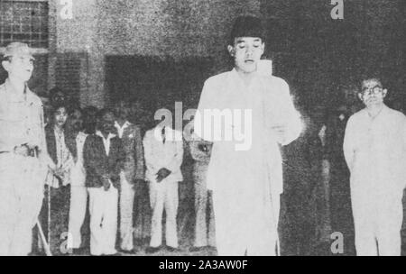 Sukarno ( 1901 – 1970 ) declares independence of Indonesia, August 17th, 1945. He became first president of Indonesia. Mohammad Hatta on right. Stock Photo