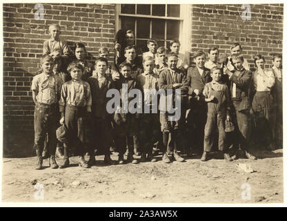 Shaw Cotton Mills. Overseer grouped all the workers, and several of them are surely under 13, and several began work under 13 last year. Stock Photo