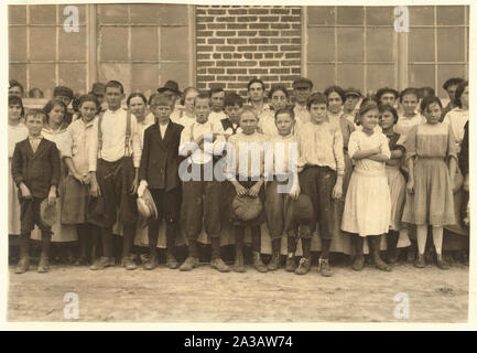 Shaw Cotton Mills. Overseer grouped all the workers, and several of them are surely under 13, and several began work under 13 last year. Stock Photo