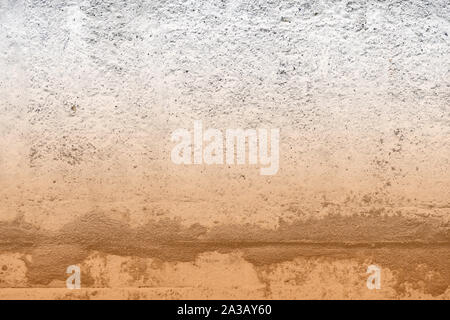 Old concrete surface close-up. Abstract background brown color toned Stock Photo