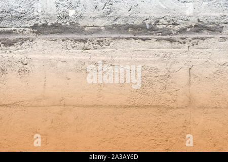 Old concrete surface close-up. Abstract background brown color toned Stock Photo