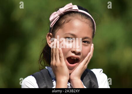 A Shocked Girl Student With Books Stock Photo