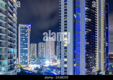 Night view of Surfers Paradise highrise buildings (including the Chevron Renaissance, Hilton Hotel and Mantra Circle on Cavill) on the Gold Coast of Q Stock Photo