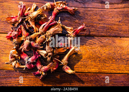 Red hazelnuts on a wooden board. Isolated hazelnuts. Stock Photo