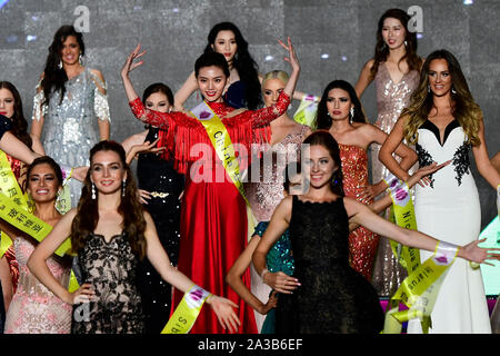 Qingdao, China. 6th Oct 2019.  Contestants showcase gowns during the Miss Tourism World 2019 Global Finals in Qingdao, east China's Shandong Province, Oct. 6, 2019. The beauty pageant concluded Sunday in the coastal city Qingdao, in which Miss Tourism Mexico Michelle Hewitt Zapata won the championship, Svetlana Mamaeva from Canada won the first runner-up, and Tan Ruoyi from China won the second runner-up.      Credit: Xinhua/Alamy Live News Stock Photo