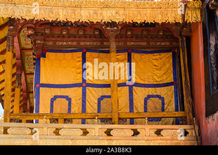 A curtained porch in the Jokhang Temple, founded about 1652 A.D.  It is the most sacred Buddhist temple in Tibet and is a UNESCO World Heritage Site. Stock Photo