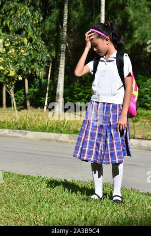 Catholic Minority Female Student Under Stress Wearing School Uniform Stock Photo
