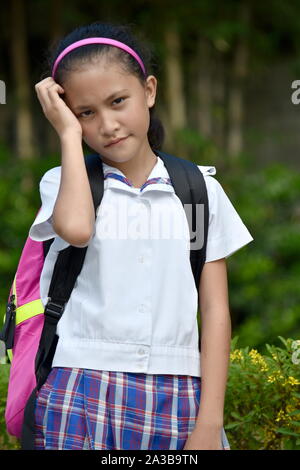 Girl Student And Worry Wearing Uniform Stock Photo