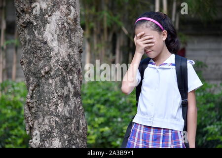 Anxious Filipina Girl Student Wearing Uniform Stock Photo