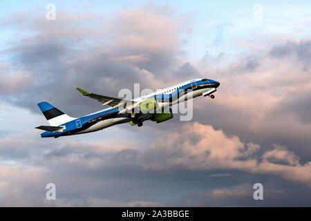 Riga, Latvia - October 03, 2019: airBaltic Passenger airplane YL-CSJ - Airbus A220-300 (Bombardier CS300) departs at the RIX International Airport at Stock Photo