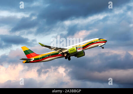 Riga, Latvia - October 03, 2019: airBaltic Passenger airplane YL-CSK - Airbus A220-300 (Bombardier CS300) departs at the RIX International Airport at Stock Photo