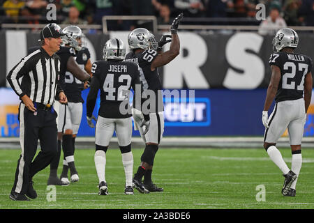 Los Angeles, USA. October 07, 2018 Los Angeles Chargers running back Melvin  Gordon (28) carries the ball as Oakland Raiders linebacker Tahir Whitehead  (59) makes the tackle during the football game between