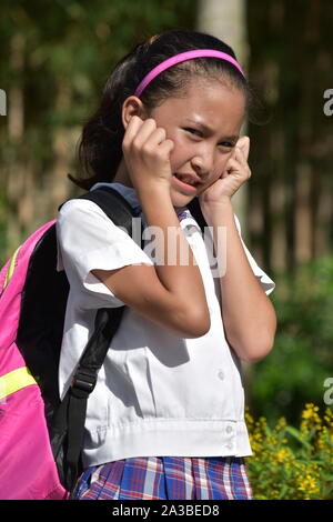 Cute Minority School Girl And Anxiety Wearing School Uniform With Notebooks Stock Photo