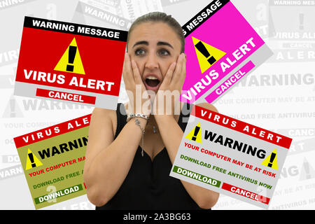 Young woman scared by various virus alert signal. Internet security concept Stock Photo