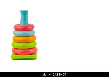 Plastic toy pyramid on a white background. Games and Copy space concept Stock Photo