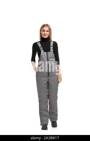 Woman in gray working overalls shot Stock Photo