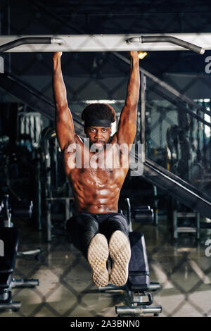 Young Man Performing Hanging Leg Raises Abs Exercise Stock Image - Image of  mature, muscular: 75350709