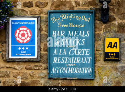 Signs on The Blinking Owl Inn, North Newington, Oxfordshire, England, UK Stock Photo