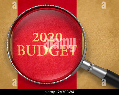 2020 Budget through Loupe on Book Title Page with Dark Red Vertical Line Background. Stock Photo