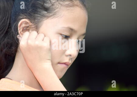 A Depressed Youthful Diverse Female Juvenile Stock Photo