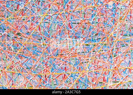 Abstract background texture of interwoven colorful threads or strings forming a random pattern in a full frame view Stock Photo