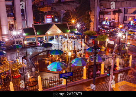 The Erawan Shrine in Bangkok Thailand. At Night. Aerial Wide Shot Stock Photo