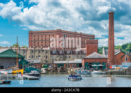 Floating Harbour at Underfall Yard with Victorian pump room & an old tobacco warehouse to the rear, Bristol, Avon, England, UK. Stock Photo