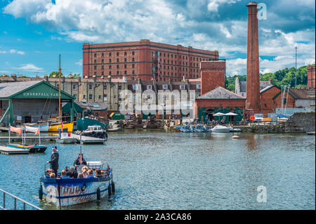 Floating Harbour at Underfall Yard with Victorian pump room & an old tobacco warehouse to the rear, Bristol, Avon, England, UK. Stock Photo