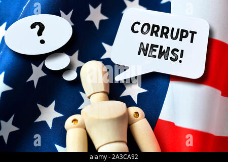 Manikin with speech bubbles on US flag, corrupt news Stock Photo