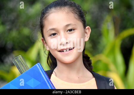Youthful School Girl Smiling With Notebooks Stock Photo