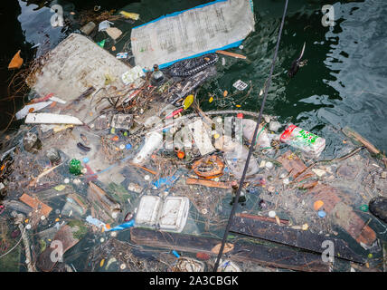 Plastic waste gathering in the sea Stock Photo