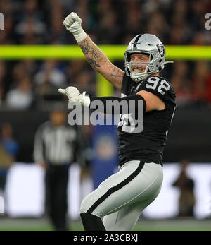 Oakland Raiders defensive end Maxx Crosby (98) gets past Kansas City Chiefs  tight end Blake Bell (81) during the second half of an NFL football game in  Kansas City, Mo., Sunday, Dec.