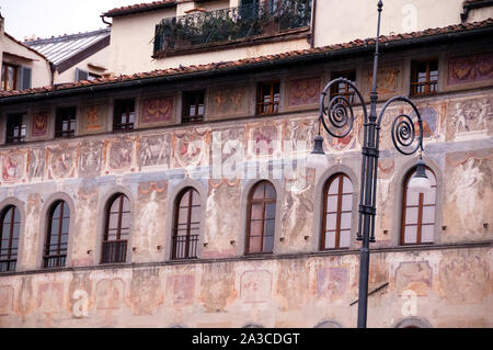 Medieval fresco paintings on Palazzo dell Antella in Florence, Italy, a long facade painted by a group of Italian artists in 1619-1620. Stock Photo