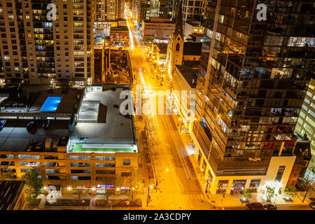 Chicago, Illinois, USA, May 9, 2019. Above view of skyscrapers in Chicago. Glass buildings reflecting the lights of the highway at night. Stock Photo