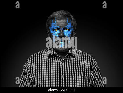Discover what's inside you. Close up portrait of senior man isolated on black studio background. Bright neon light on the face. Halloween, scary look theme, october holidays, horror concept. Stock Photo