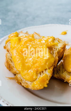 Scrambled Eggs with Croissant. Creamy Style for Breakfast. Stock Photo