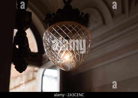 Vintage hanging chandelier with crystal glass lampshade, close-up photo with selective focus Stock Photo