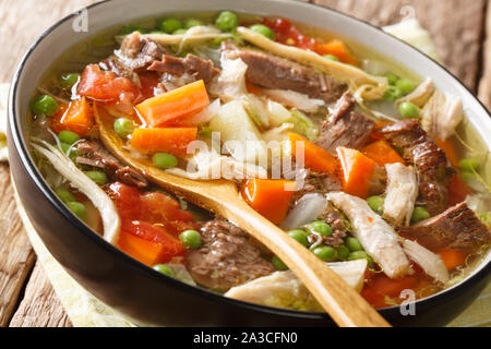 Wisconsin traditional Booyah soup with vegetables and several types of meat  close-up in a bowl on the table. Horizontal top view from above Stock Photo  - Alamy