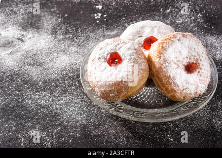 Hanukkah sufganiyot. Traditional Jewish donuts for Hanukkah. Copy space Stock Photo