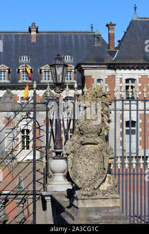Statue of a lion holding the coat of arms of the Prince de Ligne at the 14th-century Chateau de Beloeil in Beloeil (Hainaut), Belgium Stock Photo