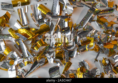 Photo background of rectangular confetti made of gold and silver foil. Stock Photo