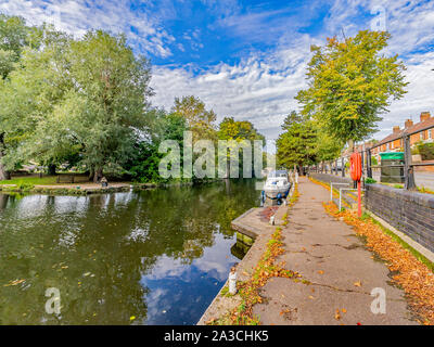 View down the path alongside the River Wensum in Norwich Stock Photo